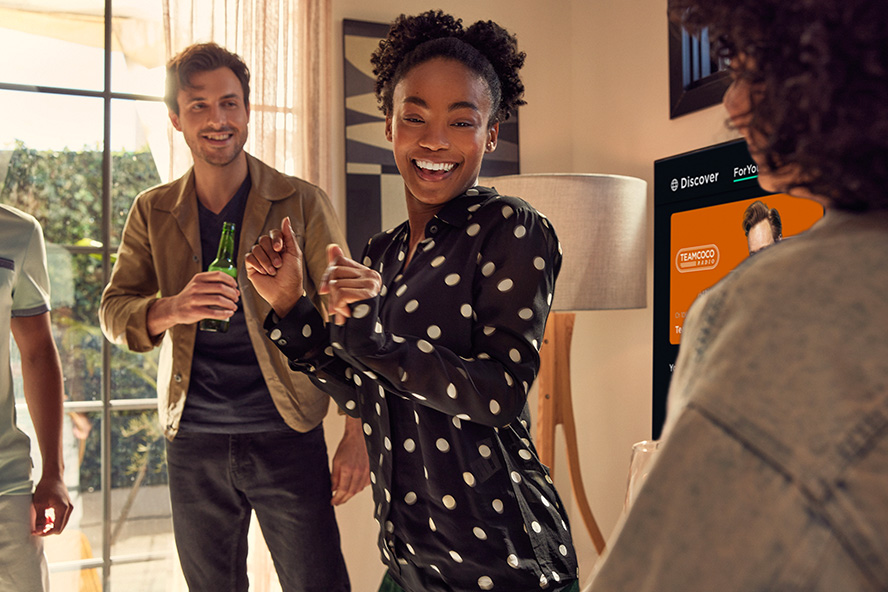 Woman and her friends dancing in a house