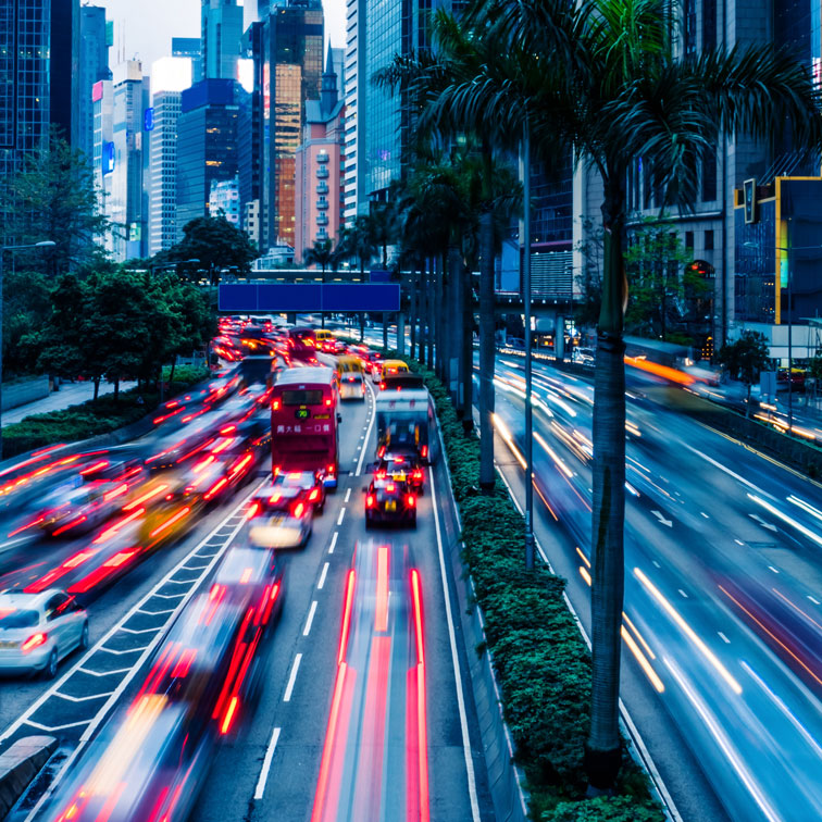 Busy city streets with cars rushing by