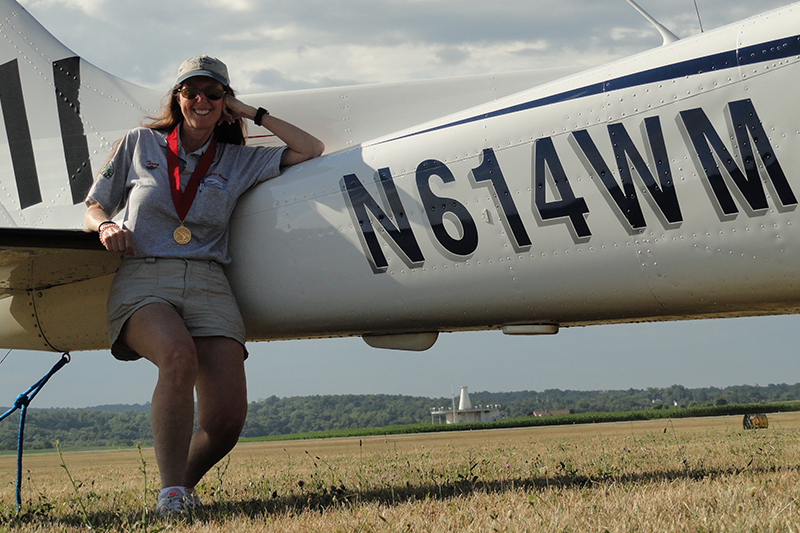 Terry leaning on a small plane