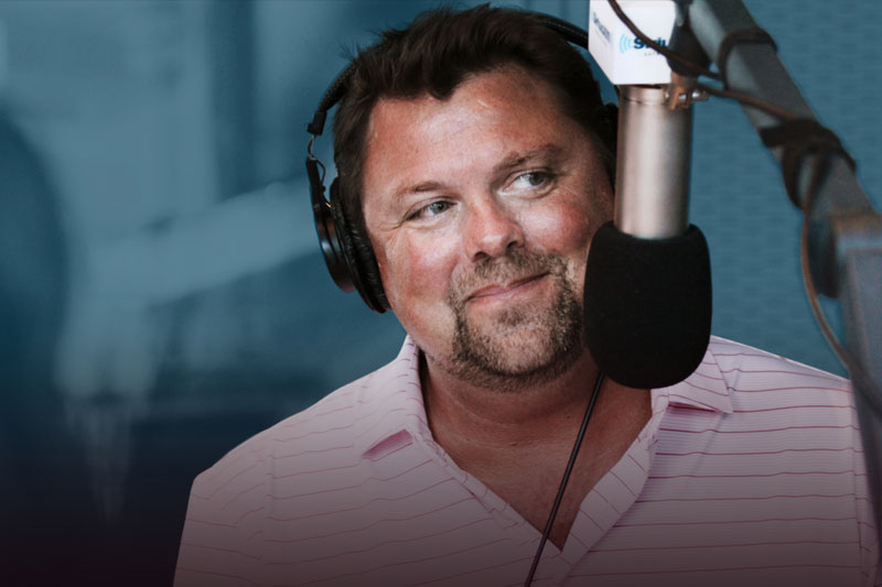 Image of Storme in studio on a mic in studio