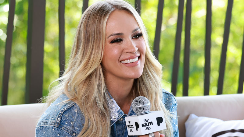 Carrie Underwood holding microphone
